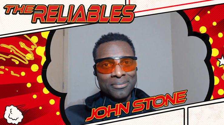 a man in sunglasses salutes the camera