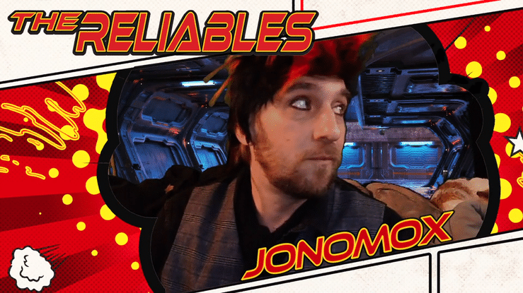 a person with a mohawk smirks into the camera